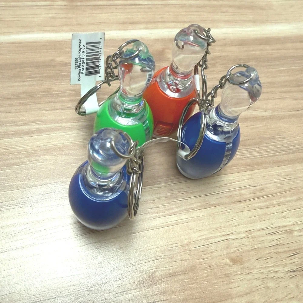 Set of 4 Bowling Pin Light Up LED Keychains Blue Green Orange Novelty